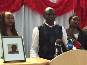 Martino Laku, President of the Council of South Sudanese Community of Manitoba (COSSCOM), addresses a media conference at the COSSCOM community centre on Monday, next to a photo of 43-year-old Machuar Madut. Winnipeg's South Sudanese community is demanding answers after Madut died following a confrontation with Winnipeg Police on Saturday at his suite in an apartment building on Colony Street just north of Broadway.