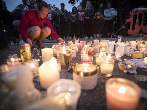 Candles are placed to commemorate victims of Friday's shooting, outside the Al Noor mosque in Christchurch, New Zealand, March 18, 2019. (AP Photo)