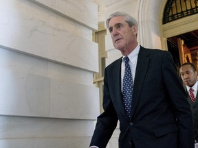 In this June 21, 2017 file photo, former FBI Director Robert Mueller, the special counsel probing Russian interference in the 2016 election, departs Capitol Hill following a closed door meeting in Washington. (AP Photo/Andrew Harnik, File)