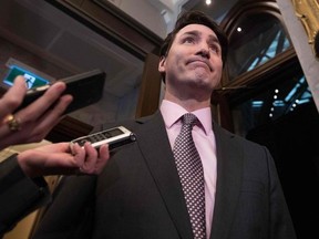 In this file photo taken on Feb. 27, 2019, Minister Justin Trudeau speaks to the media before Question Period in Ottawa.