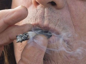 A man smokes cannabis in Kamloops, B.C. on Oct. 17, 2018.