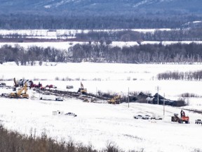 Excavators work at the site of a train derailment ten-kilometres south of St. Lazare, Man. on Saturday February 16, 2019. Investigators say at least one million litres of crude oil was released when a train derailed in western Manitoba earlier this month.THE CANADIAN PRESS/Michael Bell