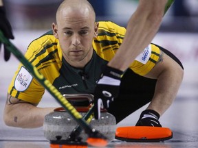 Northern Ontario third Ryan Fry makes a shot as his team plays Newfoundland and Labrador during curling action at the Brier in Calgary, Thursday, March 5, 2015.