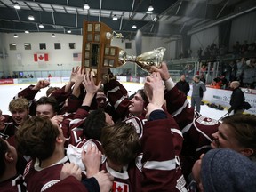 The St. Paul’s Crusaders celebrate thier victory over the Sturgeon Heights Huskies in the provincial high school hockey final at Bell MTS Iceplex in Winnipeg yesterday, making it four championships in a row for the school. (Kevin King/Winnipeg Sun)