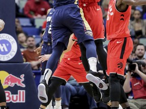 Pelicans centre Julius Randle gets blocked by Raptors centre Serge Ibaka (right) during their game at the Smoothie King Center in New Orleans last night. The Raptors won 127-104.(AP)
