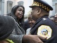 FILE - In this Dec. 1, 2016, file photo, Kim Foxx, left, greets Police Superintendent Eddie Johnson at her swearing in ceremony as the new Cook County State's Attorney in Chicago. The outrage was swift and overwhelming: How could prosecutors in Chicago drop charges against former "Empire" cast member Jussie Smollett for allegedly orchestrating a fake attack and allow him to wipe his record clean without so much as an apology? But for all of the public outrage, the Chicago Police Department and Cook County State's Attorney's Office insist their relationship is strong, even if they didn't agree on the outcome in Smollett's case.