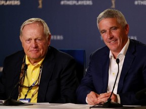 Golf legend Jack Nicklaus (left) and PGA Tour Commissioner Jay Monahan (right) speak to the media during a practice round for The Players Championship on The Stadium Course at TPC Sawgrass in Ponte Vedra Beach, Fla., on Wednesday, March 13, 2019.