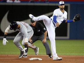 Lourdes Gurriel Jr. of the Toronto Blue Jays forces out Nicholas Castellanos of the Detroit Tigers during the season opener in Toronto Thursday March 28, 2019. (Dave Abel/Toronto Sun)