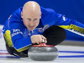 Team Alberta skip Kevin Koe makes a shot against Team Saskatchewan at the Brier in Brandon, Man. Friday, March, 8, 2019. (THE CANADIAN PRESS/Jonathan Hayward)