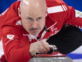 Canada skip Kevin Koe delivers a shot as they face South Korea at the world men's curling championship in Lethbridge, Alta., on Saturday, March 30, 2019.