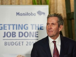 Manitoba Premier Brian Pallister speaks to media following the delivery of Manitoba's 2019 budget, at the Legislative Building in Winnipeg, Thursday, March 7, 2019.