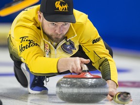 Team Manitoba skip Mike McEwen makes a shot during the 8th draw against Team Newfoundland and Labrador at the Brier in Brandon, Man. Tuesday, March 5, 2019. (THE CANADIAN PRESS/Jonathan Hayward)