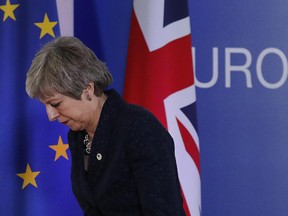 British Prime Minister Theresa May leaves after addressing a media conference at an EU summit in Brussels, Friday, March 22, 2019.