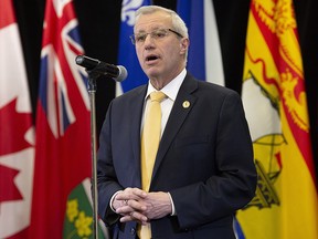 Ontario Finance Minister Vic Fedeli speaks with media following meetings with federal, provincial and territorial counterparts in Ottawa, Monday December 10, 2018. (THE CANADIAN PRESS/Adrian Wyld)