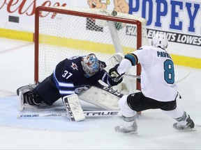 San Jose Sharks' Joe Pavelski (8) scores into the top of the net with a few seconds left to win the game against the Winnipeg Jets during third period NHL hockey action in Winnipeg, Tuesday, March 12, 2019. THE CANADIAN PRESS/Trevor Hagan