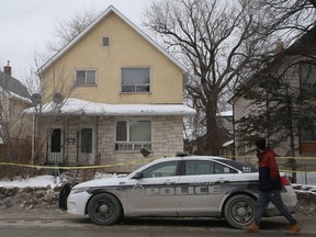 Police investigate at the scene of a homicide on Friday, March 8, 2019, in the 200 block of Selkirk Avenue in Winnipeg. Two teens and another man are facing charges.