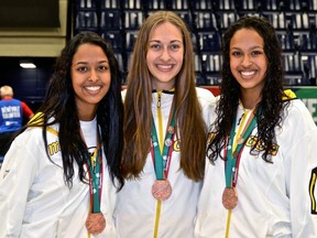 Montana Kinzel (centre) with twin sisters Sarah (left) and Jasmine Ibrahim after they won basketball bronze with Team Manitoba at the 2013 Canada Summer Games in Sherbrooke, Que. Kinzel is co-organizing a fundraising dinner called Sarah Strong to raise awareness for mental health struggles. Sarah Ibrahim killed herself in Oct. 2017.