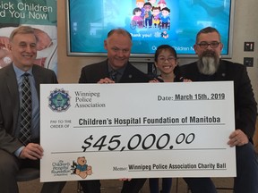 (Left to right) Gary Rozak, Director of Corporate Partnerships and Stakeholder Relations, Children’s Hospital Foundation of Manitoba; Winnipeg Police Association President Maurice (Moe) Sabourin; 2019 Children’s Hospital Foundation of Manitoba Champion Child, Gianna Eusebio; and WPA Vice-President George Van Mackelbergh pose with a $45,000 cheque which was donated by the Winnipeg Police Association to the Children’s Hospital Foundation of Manitoba on Friday, March 15, 2019 in Winnipeg. The donation was proceeds from the 2018 WPA Charity Ball and is the largest, single year donation ever and brings WPA's total over 33 years to in excess of $650,000.