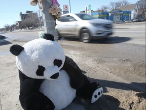 A stuffed toy sits at a makeshift memorial at the crosswalk at Isabel Street and Alexander Avenue where a four-year-old girl died and a woman seriously injured.