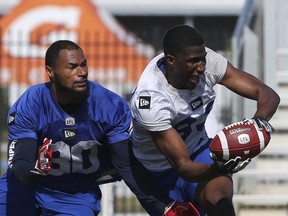 Winnipeg Blue Bombers defensive back Joe Este (30) defends wide receiver Josh Stewart (83) during a team mini-camp at IMG Academy in Bradenton Florida on Wednesday, April 24, 2019.

Photo by Tom O'Neill