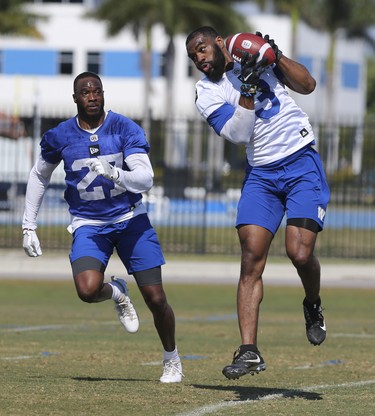 Winnipeg Blue Bombers wide receiver Rasheed Bailey (3) catches a pass in front of defensive back Mykkele Thompson (27) during a team mini-camp at IMG Academy in Bradenton Florida on Wednesday, April 24, 2019.

Photo by Tom O'Neill