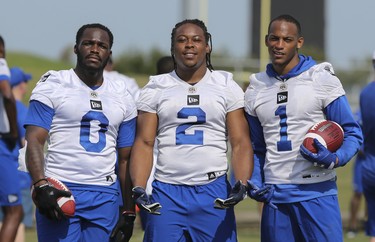 Winnipeg Blue Bombers running backs Jalen Simmons (0) Marquell Cartwright (2) and Larry Rose (1) take time for a photo during a team mini-camp at IMG Academy in Bradenton Florida on Thursday, April 25, 2019.

Photo by Tom O'Neill