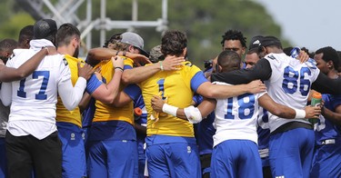 Winnipeg Blue Bombers teammates huddle at the end of a team mini-camp at IMG Academy in Bradenton Florida on Thursday, April 25, 2019.

Photo by Tom O'Neill