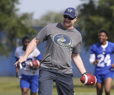 Winnipeg Blue Bombers Head Coach Mike O'Shea tosses an errant pass back to players during a team mini-camp at IMG Academy in Bradenton Florida on Thursday, April 25, 2019.

Photo by Tom O'Neill