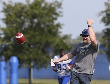 Winnipeg Blue Bombers Head Coach Mike O'Shea tosses an errant pass back to players during a team mini-camp at IMG Academy in Bradenton Florida on Thursday, April 25, 2019.

Photo by Tom O'Neill