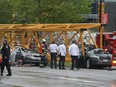 Emergency crews work at the scene of a construction crane collapse near the intersection of Mercer Street and Fairview Avenue near Interstate 5 Saturday, April 27, 2019, in Seattle. (Alan Berner/The Seattle Times via AP)