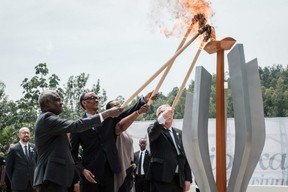 TOPSHOT - (From L) African Union chief Moussa Faki, Rwanda's President Paul Kagame, his wife Jeannette (2ndR), and European Commission President Jean-Claude Juncker light a remembrance flame for the 25th Commemoration of the 1994 Genocide at the Kigali Genocide Memorial in Kigali, Rwanda, on April 7, 2019. - Rwanda on April 7, 2019 began 100 days of mourning for more than 800,000 people slaughtered in a genocide that shocked the world, a quarter of a century on from the day it began. (Photo by Yasuyoshi CHIBA / AFP)YASUYOSHI CHIBA/AFP/Getty Images