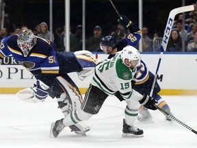 St. Louis Blues goaltender Jordan Binnington is upended by Dallas Stars forward Blake Comeau after Binnington left the net 
to clear a loose puck in Game 1. The collision led to a melee that could set the tone for the series. (AP)