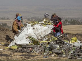 In this March 11, 2019, file photo, rescuers work at the scene of an Ethiopian Airlines flight crash near Bishoftu, Ethiopia.