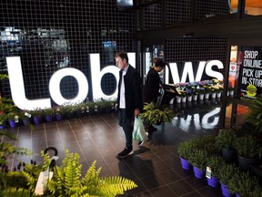 A man leaves a Loblaws store in Toronto on May 3, 2018. Critics are slamming the federal government's decision to give $12 million to help Loblaws make their fridges and freezers more energy-efficient.