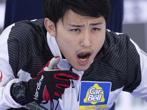 Japan skip Yuta Matsumura calls for the sweep during their game against the Netherlands at the Men's World Curling Championship in Lethbridge, Alta. on Monday, April 1, 2019.