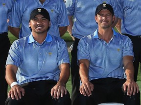 Jason Day, left, and Adam Scott pose as members of the International Team during the 2013 Presidents Cup in Dublin, Ohio. (David Cannon/Getty Images)