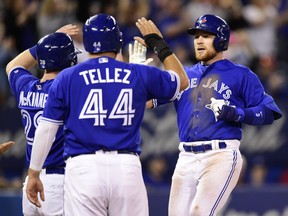 Toronto Blue Jays Brandon Drury (right) celebrates his game-tying three-run homer with teammates Billy McKinney and Rowdy Tellez against the Oakland Athletics during American League baseball action in Toronto on Sunday, April 28, 2019. THE CANADIAN PRESS/Frank Gunn