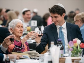 Prime Minister Justin Trudeau chats with Evelyn Rabkin during a Passover Seder at the Bernard Betel Centre in Toronto, Friday, April 19, 2019. THE CANADIAN PRESS/Galit Rodan