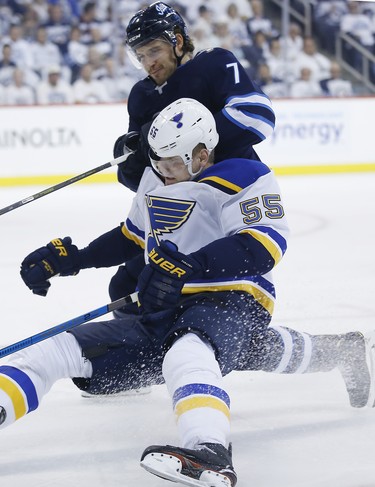 Winnipeg Jets defenceman Ben Chiarot (7) battles St. Louis Blues defenceman Colton Parayko (55) during first period NHL playoff action in Winnipeg on Wednesday, April 10, 2019. THE CANADIAN PRESS/John Woods