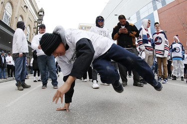 Winnipeg Jets fan Ovide McLeod dances at the Winnipeg Jets White Out Party prior to first round NHL playoffs action between the Jets and St. Louis Blues in Winnipeg on Wednesday, April 10, 2019. THE CANADIAN PRESS/John Woods