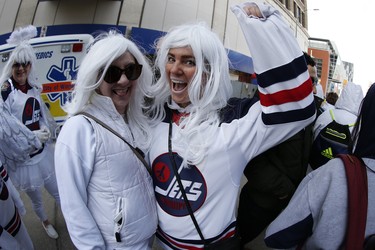 Fans Melinda Sellwood and Nicole Kjartanson gather for the Winnipeg Jets White Out Party prior to first round NHL playoffs action between the Jets and St. Louis Blues in Winnipeg on Wednesday, April 10, 2019. THE CANADIAN PRESS/John Woods