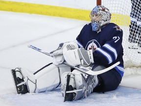 Winnipeg Jets goaltender Connor Hellebuyck (37) reacts after St. Louis Blues' Jaden Schwartz scored the game winning goal with 15 seconds left in third period NHL playoff action in Winnipeg on Thursday.