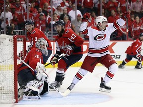 Brock McGinn of the Carolina Hurricanes scores the game winning goal against Braden Holtby of the Washington Capitals at 11:05 of the second overtime period in Game Seven of the Eastern Conference First Round during the 2019 NHL Stanley Cup Playoffs at the Capital One Arena on April 24, 2019 in Washington, D.C.