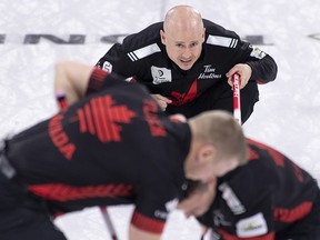 Canada skip Kevin Koe watches his shot being swept in their game against Switzerland at the Men's World Curling Championship in Lethbridge, Alta. on Friday, April 5, 2019.
