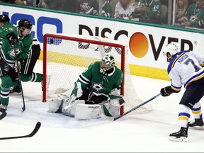 Dallas Stars' Esa Lindell (left) looks on as Stars goaltender Ben Bishop is unable to stop a shot by St. Louis Blues' Pat Maroon in the third period of Game 3 of an NHL second-round playoff series in Dallas on April 29, 2019. (TONY GUTIERREZ/AP)