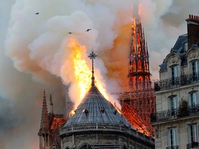 Smoke and flames rise during a fire at the landmark Notre-Dame Cathedral in central Paris on April 15, 2019, potentially involving renovation works being carried out at the site, the fire service said.