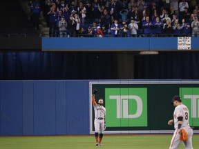 Giants’ Kevin Pillar salutes the crowd from centre field during the first inning on Tuesday night in Toronto. (GETTY IMAGES)