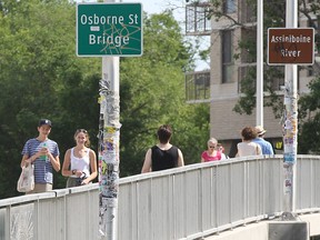 Pedestrians cross the west side of the Osborne Street Bridge. Three men were sent to hospital after being stabbed in a fight in the are of the bridge early Saturday morning.