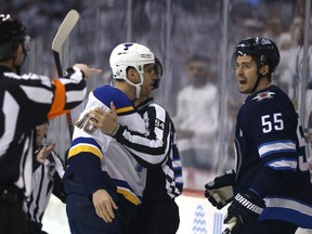 Jets centre Mark Scheifele (right) is challenged to a fight by Blues forward Brayden Schenn after getting a penalty for bumping St. Louis goaltender Jordan Binnington during Game 1 of their first-round playoff series on Wednesday night at Bell MTS Place. (Kevin King/Winnipeg Sun)