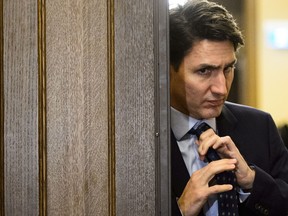 Prime Minister Justin Trudeau adjusts his tie as he leaves a cabinet meeting on route to vote in the House of Commons on Parliament Hill in Ottawa on Tuesday, April 9, 2019. THE CANADIAN PRESS/Sean Kilpatrick